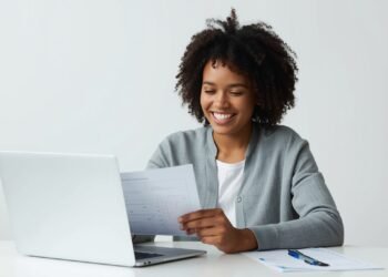 Man researching how personal loans work on a laptop at home