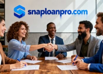 Business professionals shaking hands at a SnapLoanPro meeting after securing a business loan