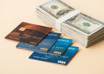 Clean financial scene with stacked credit cards, cash bundles