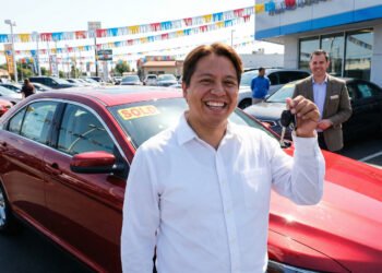 Person holding car keys after purchasing a vehicle using a personal loan